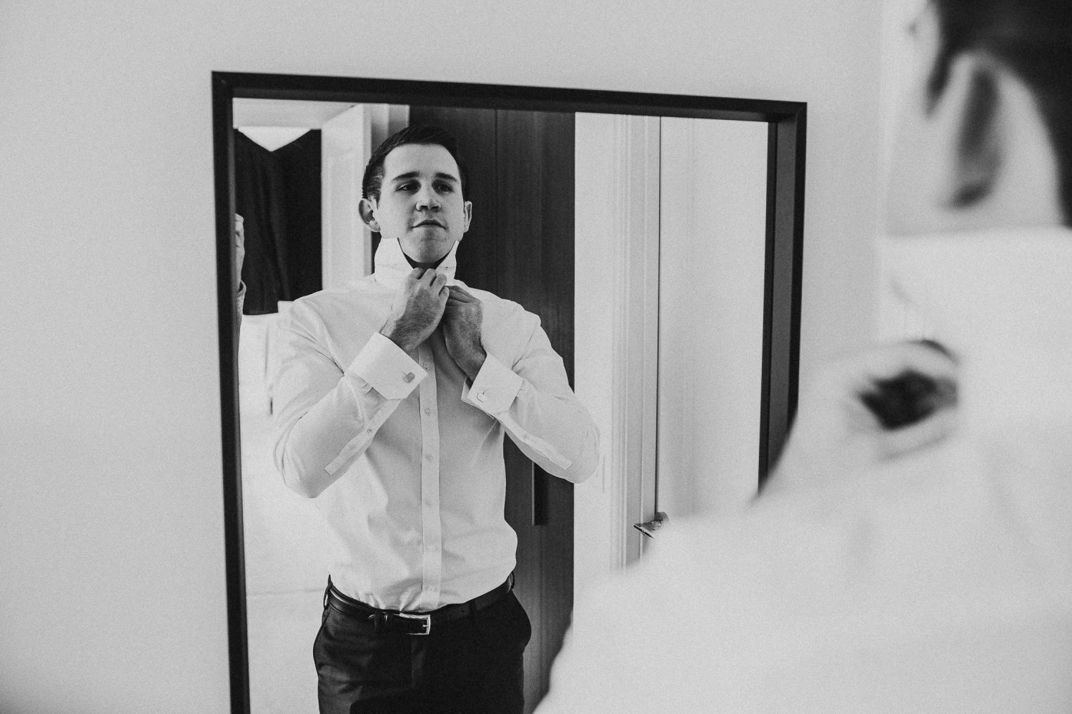 luxury manor house hotel wedding groom getting ready black and white