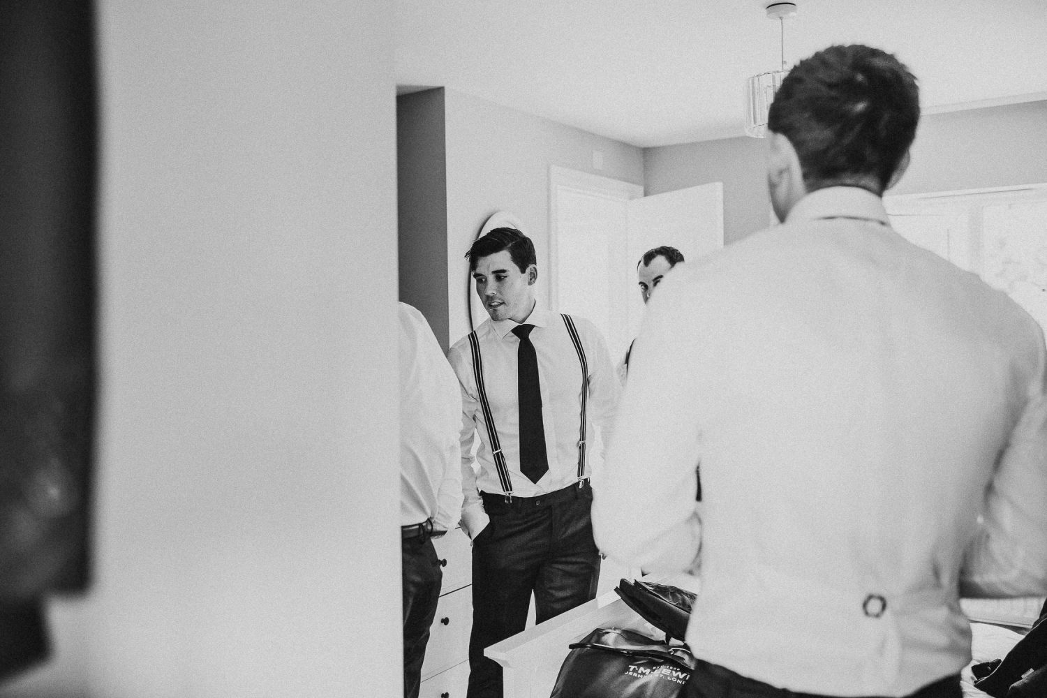 luxury manor house hotel wedding black and white groom and groomsmen getting ready