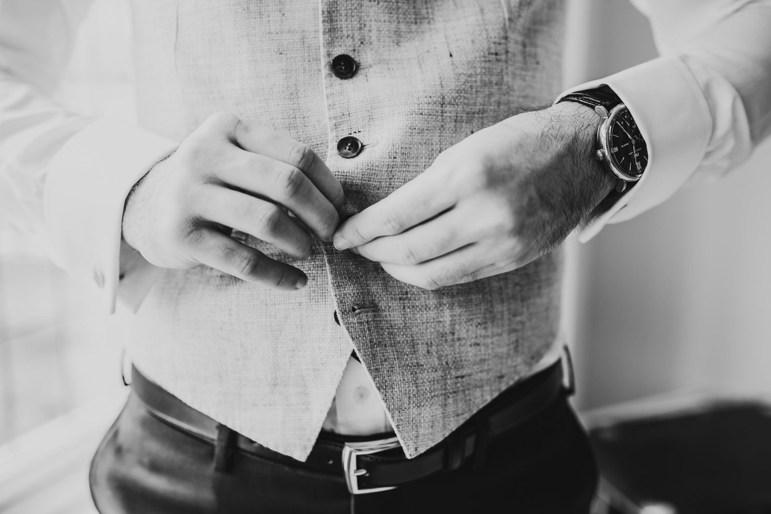 luxury manor house hotel wedding groom getting ready before wedding black and white