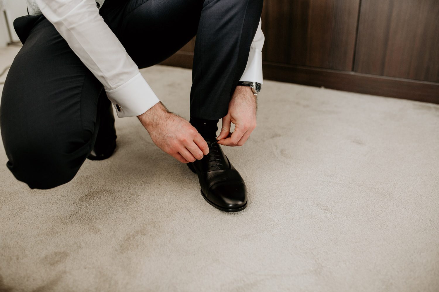 luxury manor house hotel wedding tying shoes