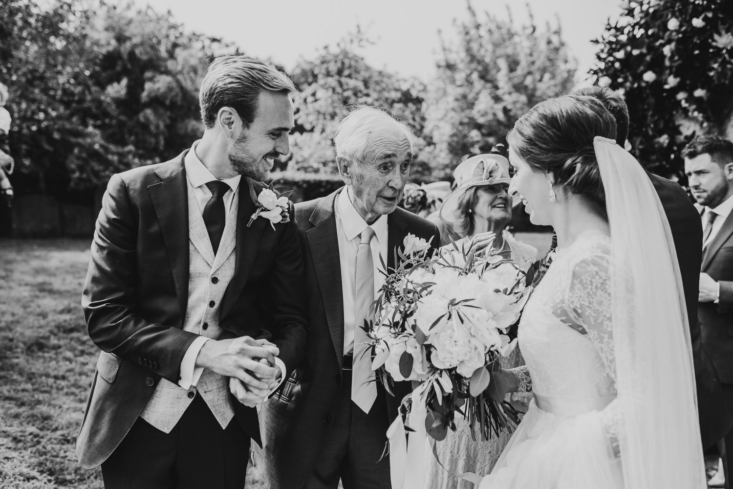 luxury manor house hotel wedding black and white bride and groom greeting family and guests