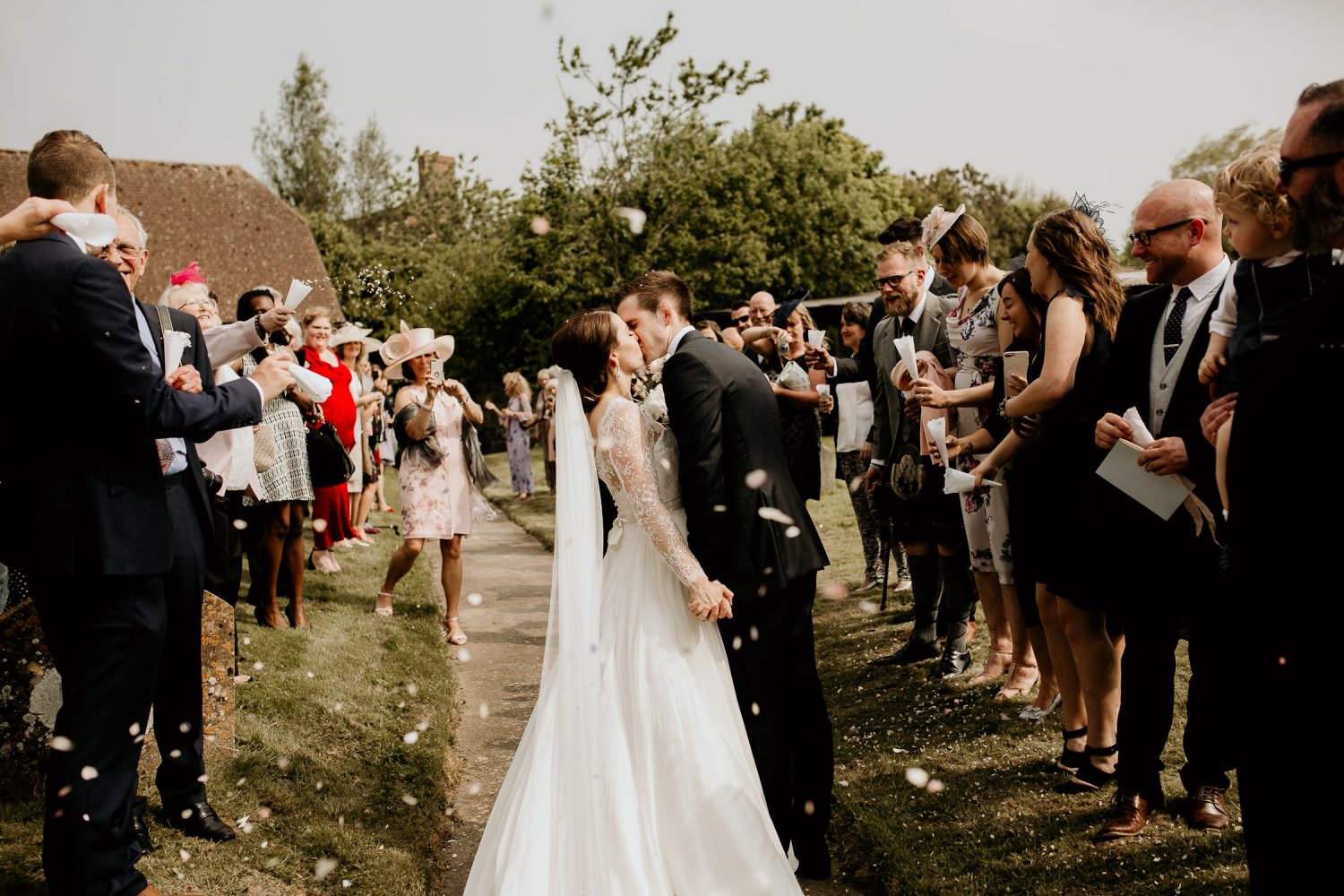 luxury manor house hotel wedding bride and groom kiss under the confetti