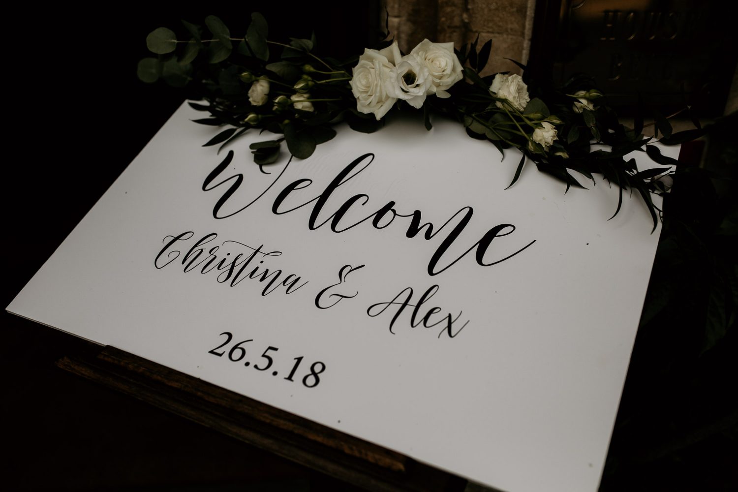 luxury manor house hotel wedding welcome sign with white flowers