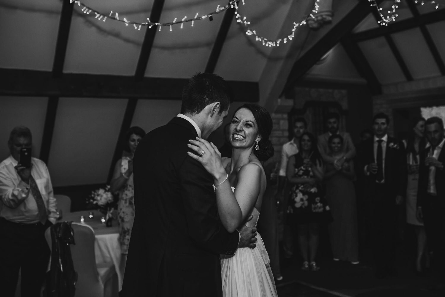 luxury manor house hotel wedding smiling bride and groom black and white first dance