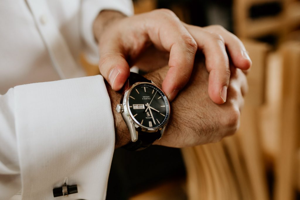 groom putting on surprise watch from groom box