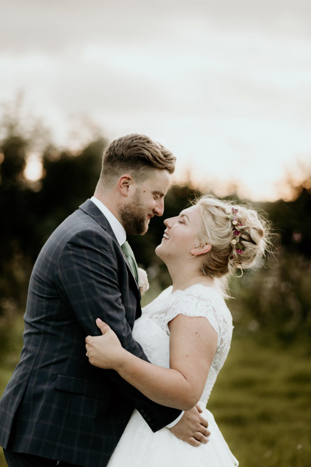 bride and groom laughing and hugging outside of wedding venueRELAXED FUN RUSTIC WEDDING LLANGYNWYD MARQUEE BRIDGEND 332 70