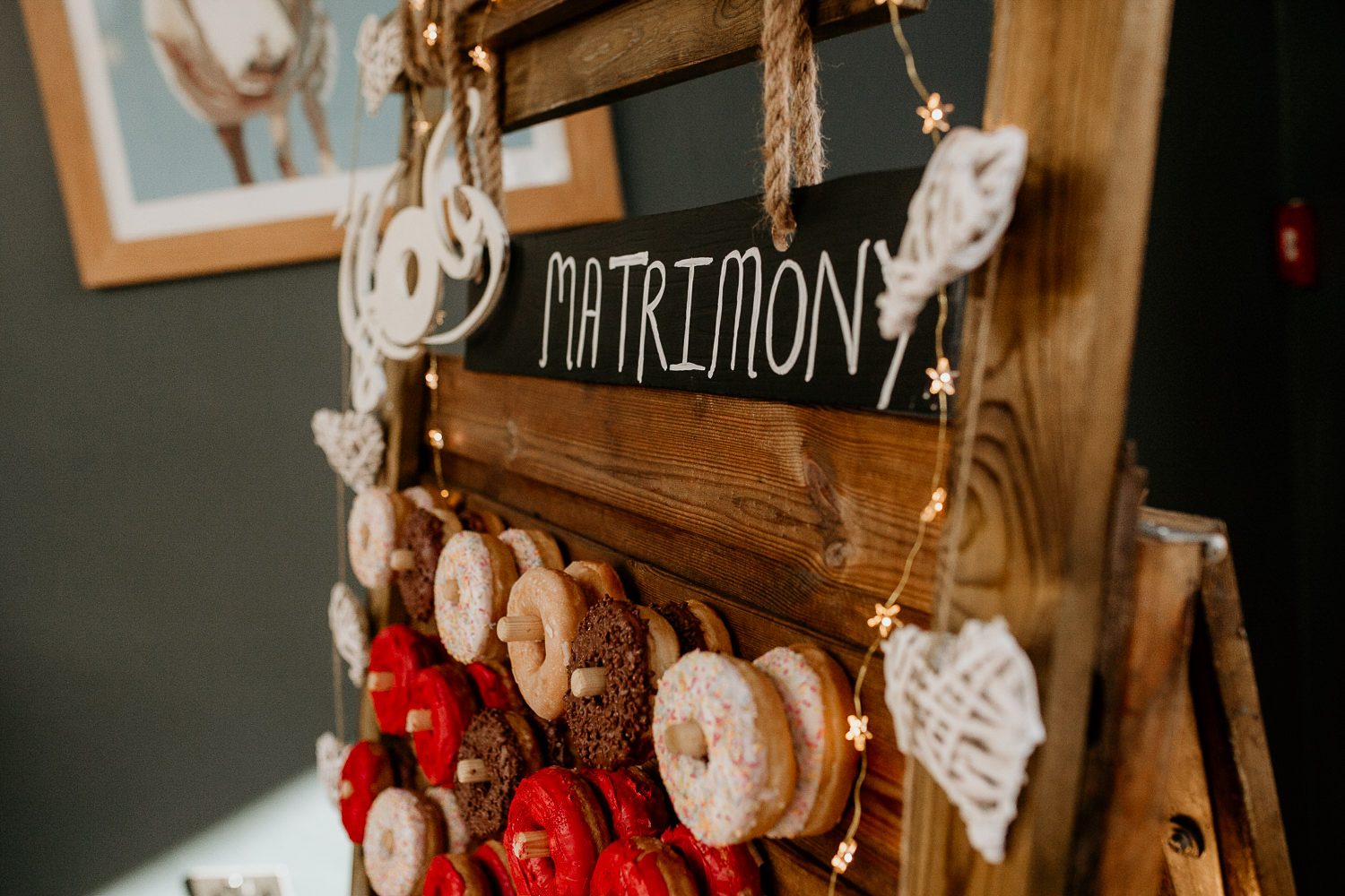 fun and quirky alternative wedding decorations matrimony sign and doughnut bar