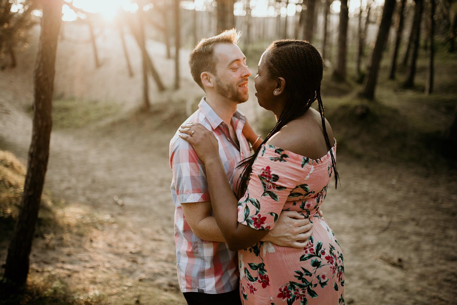 relaxed woodland engagement shoot bride and groom embracing