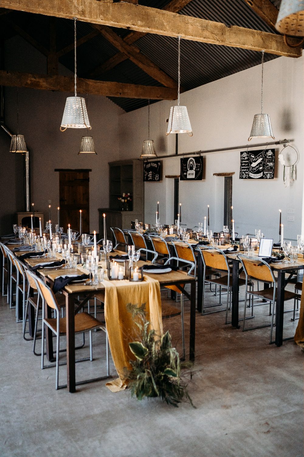 Barn Wedding Reception Decor with Taper Candles and Table Runner