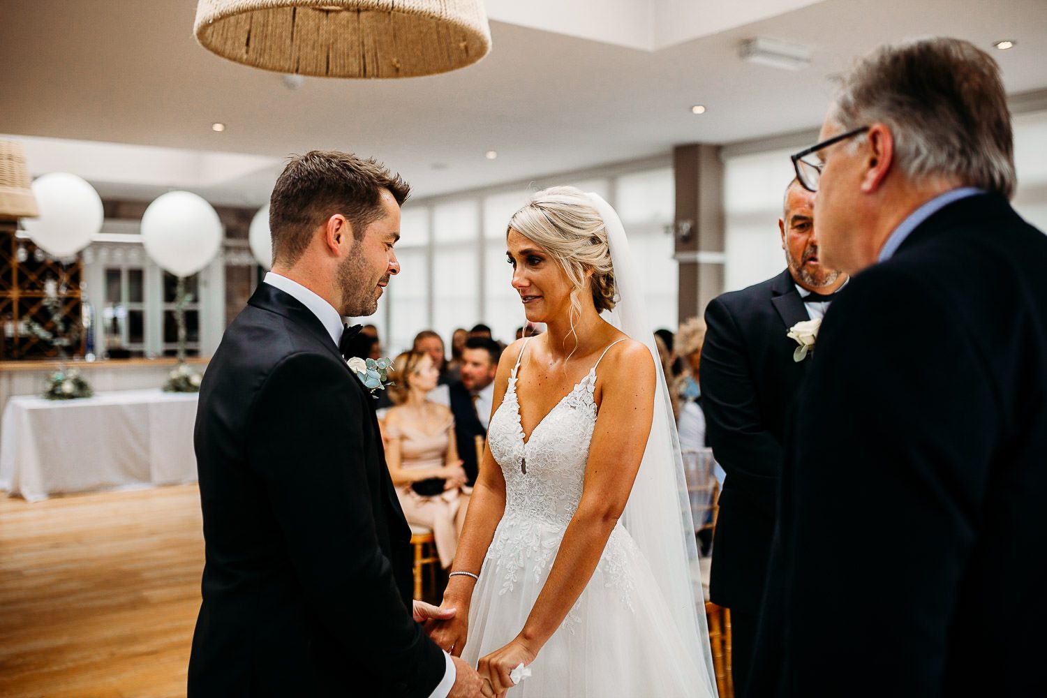emotional bride and groom crying during wedding vows