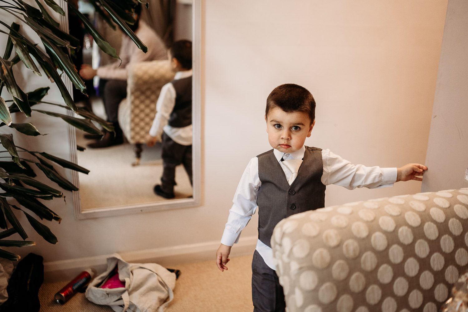 page boy smiling during bride preparations