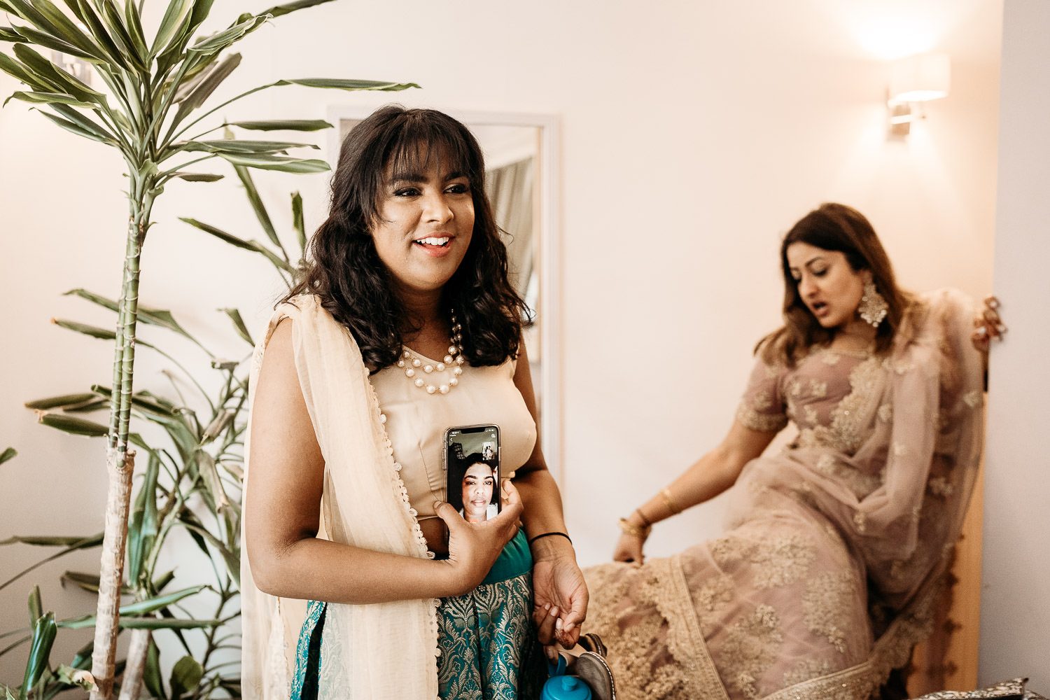 bride's friends getting ready for indian wedding