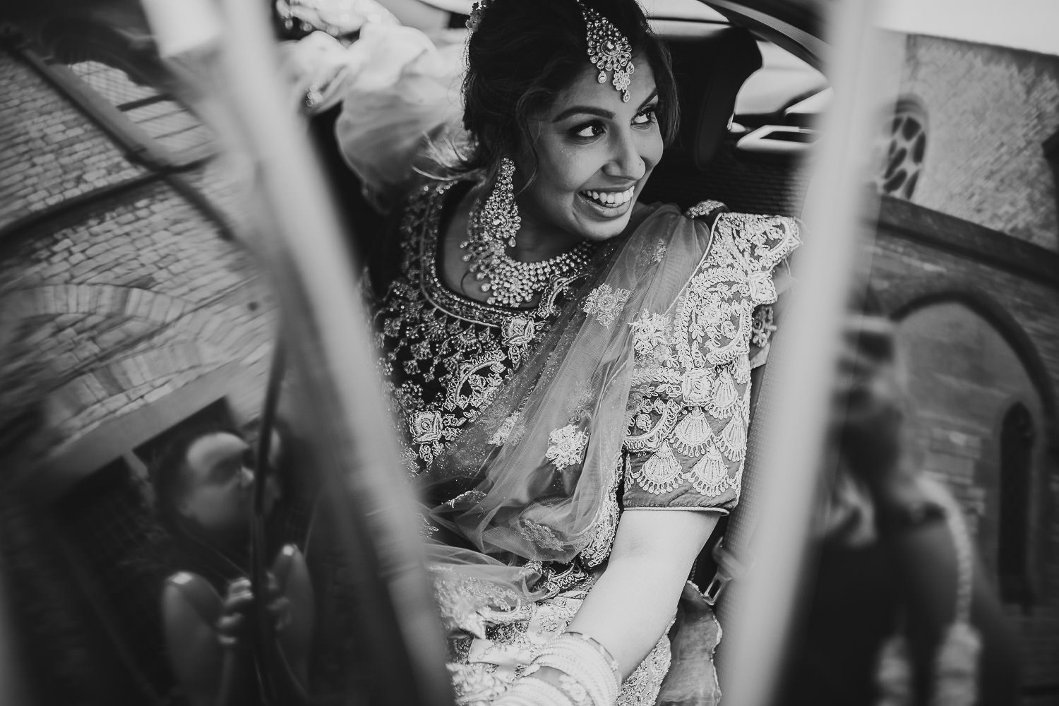 indian bride getting out of car before wedding ceremony