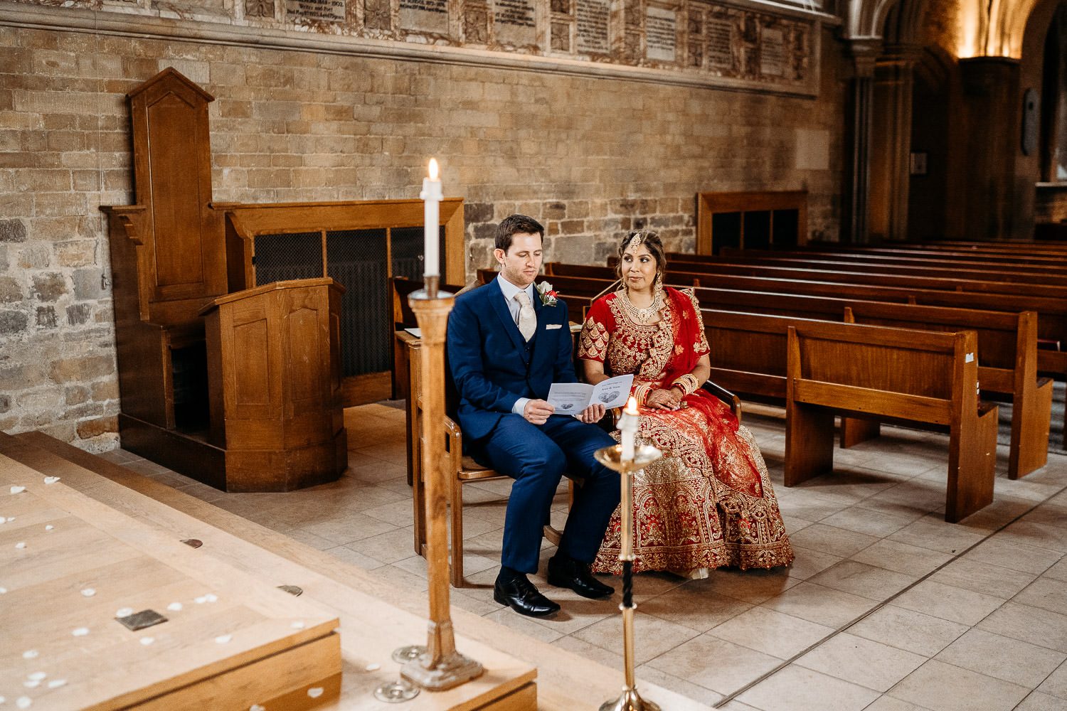 bride and groom reading wedding vows
