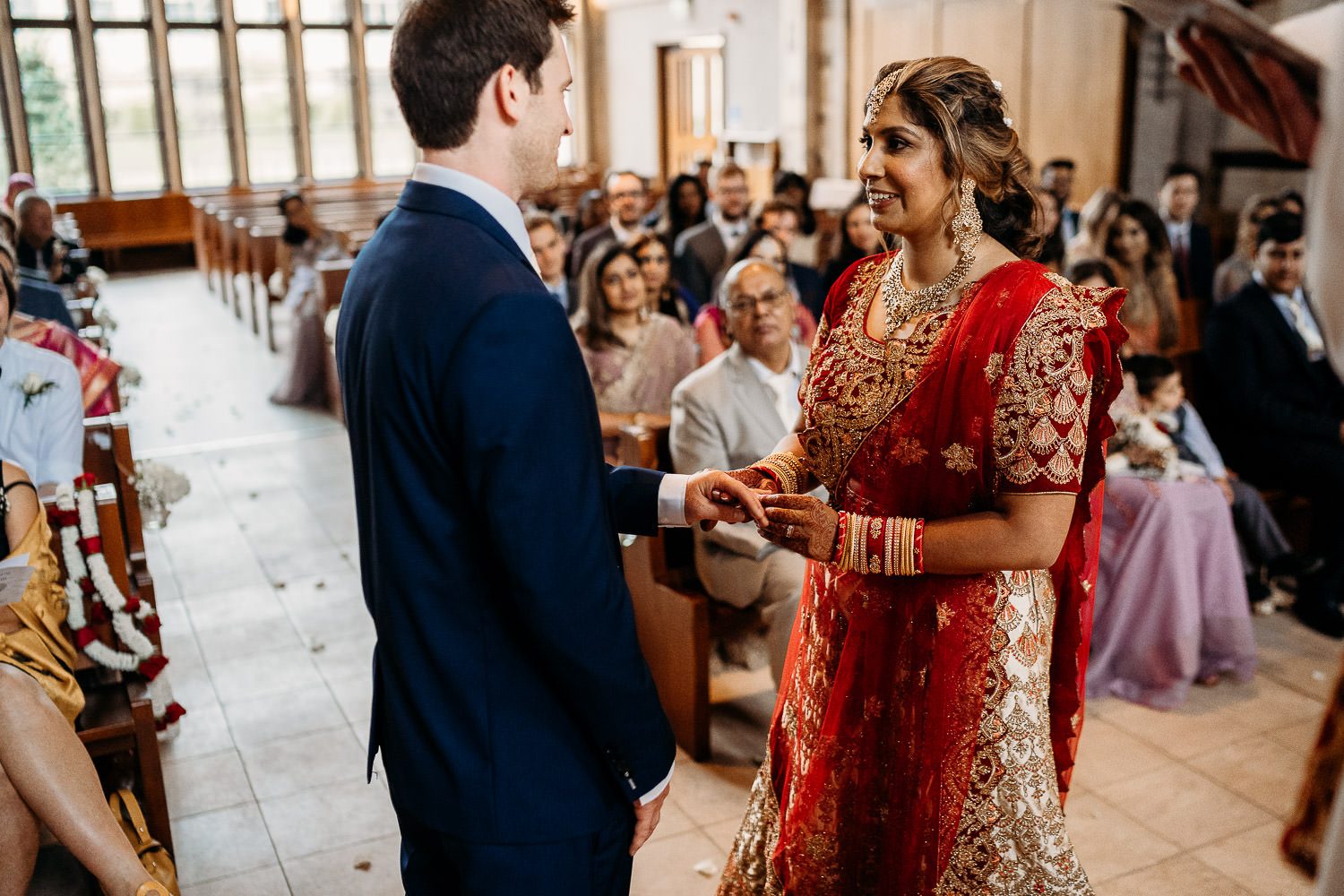 indian bride and groom exchanging wedding rings