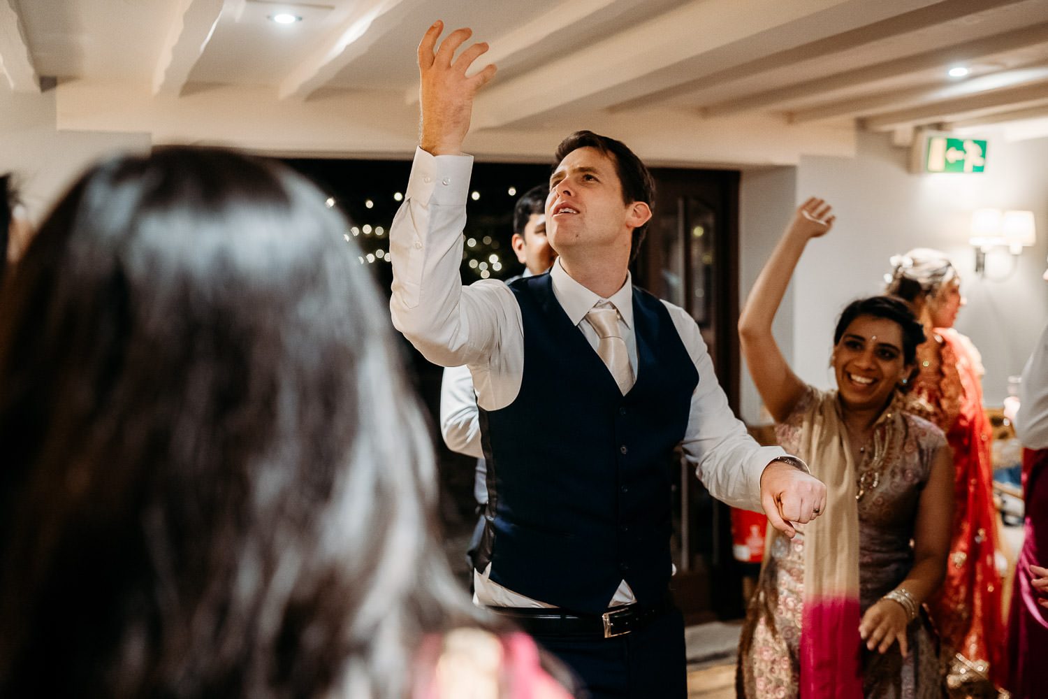 GROOM DANCING AT INDIAN WEDDING
