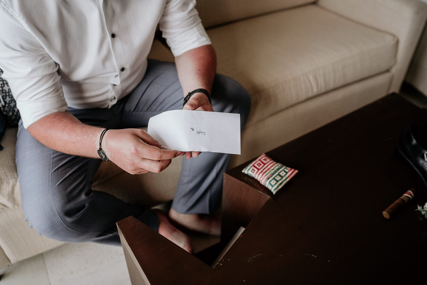 groom opening surprise gift from bride