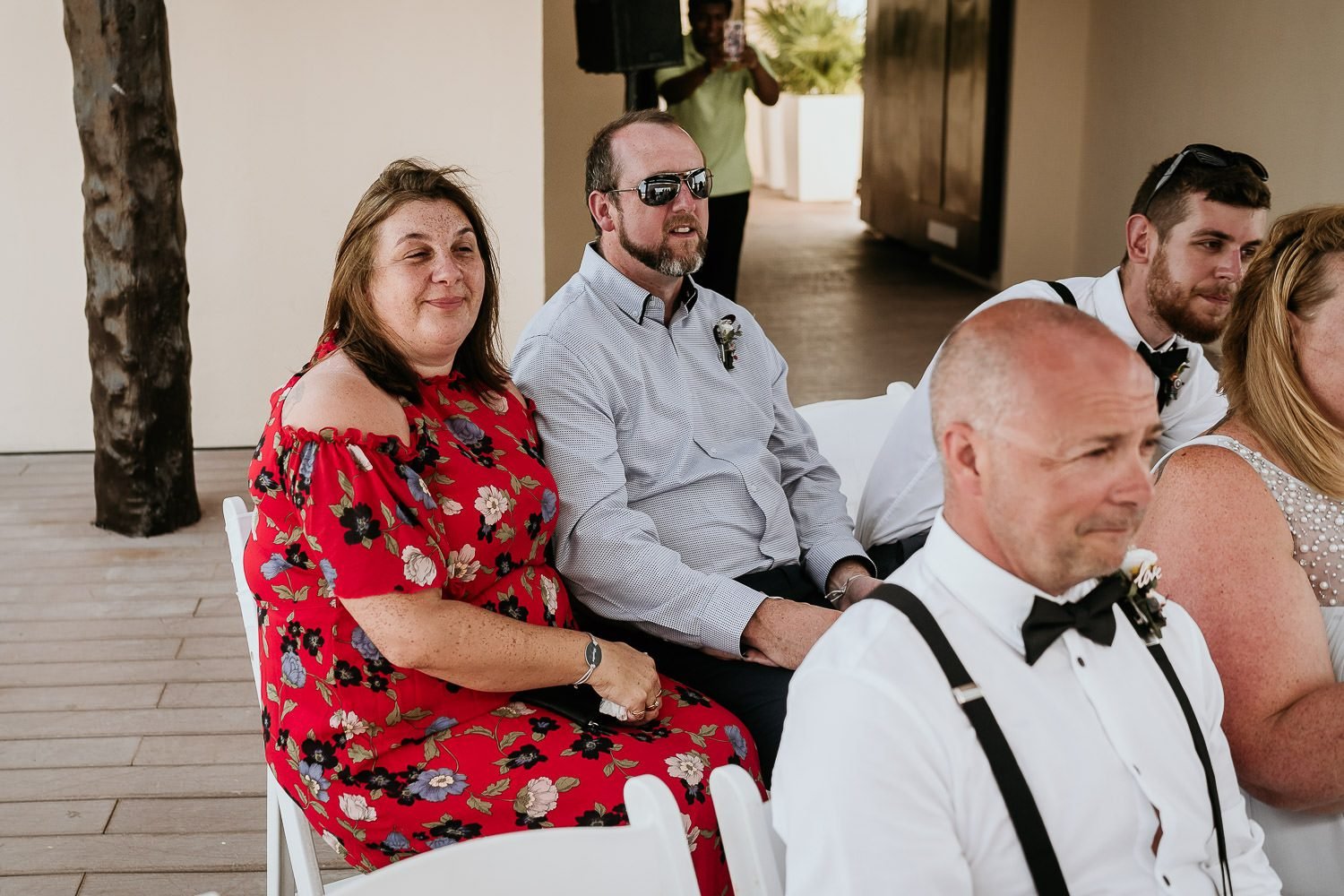 emotional wedding guests watching wedding ceremony