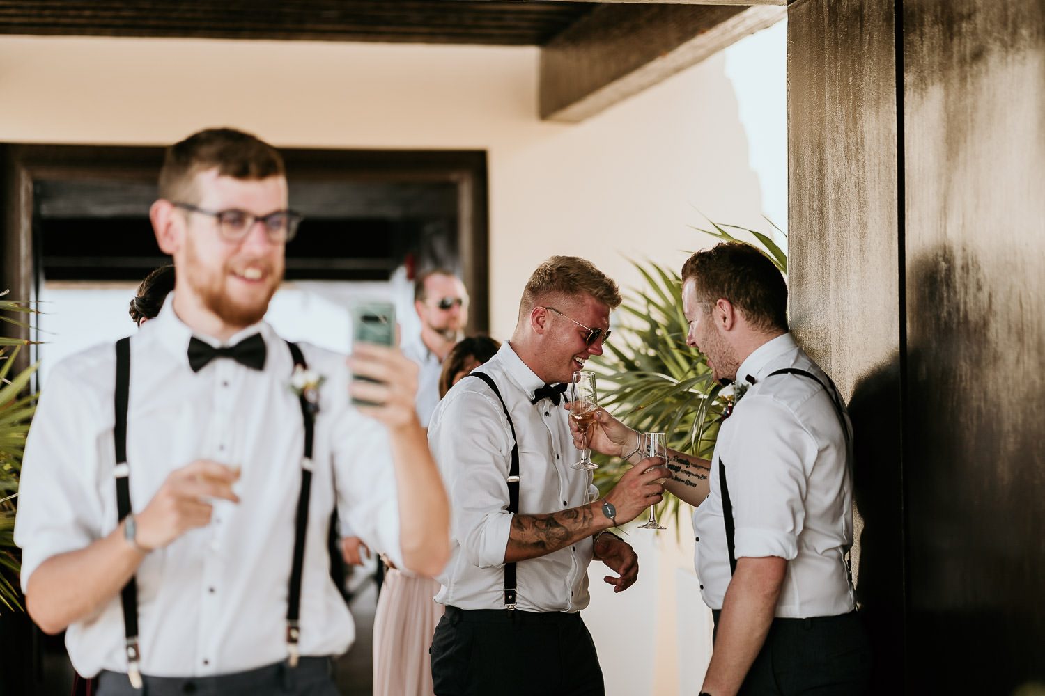 groomsmen laughing after wedding ceremony