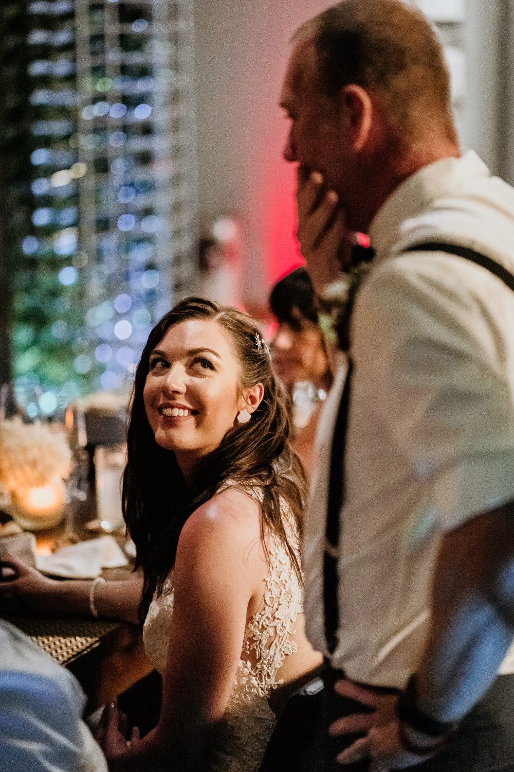 bride smiling at father of bride during wedding speech in cancun destination wedding