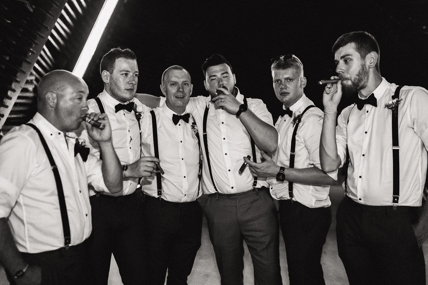 groom and groomsmen smoking cigars at royalton riviera