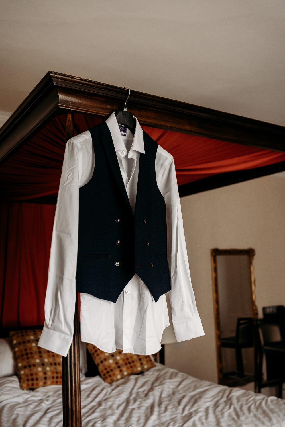 grooms wedding suit hanging up in mercure elcot hotel room