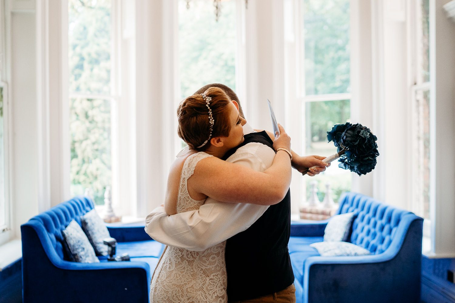 bride and groom hugging during first look at mercure elcot hotel