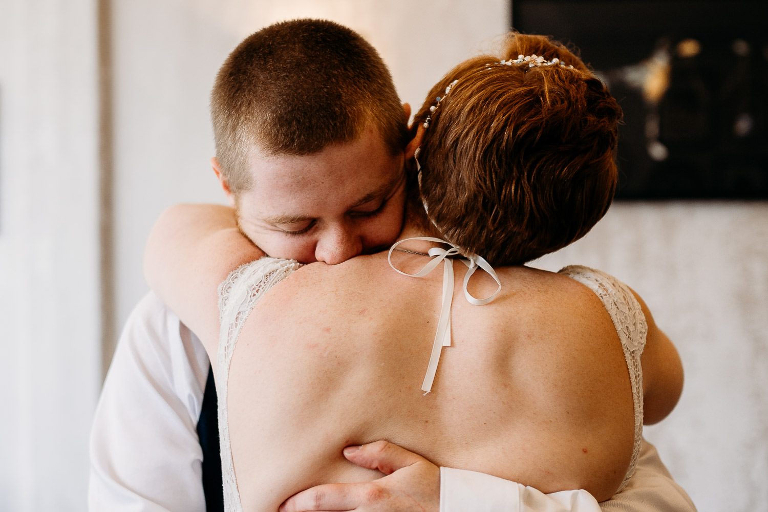 groom hugging bride and crying during first look at mercure elcot hotel