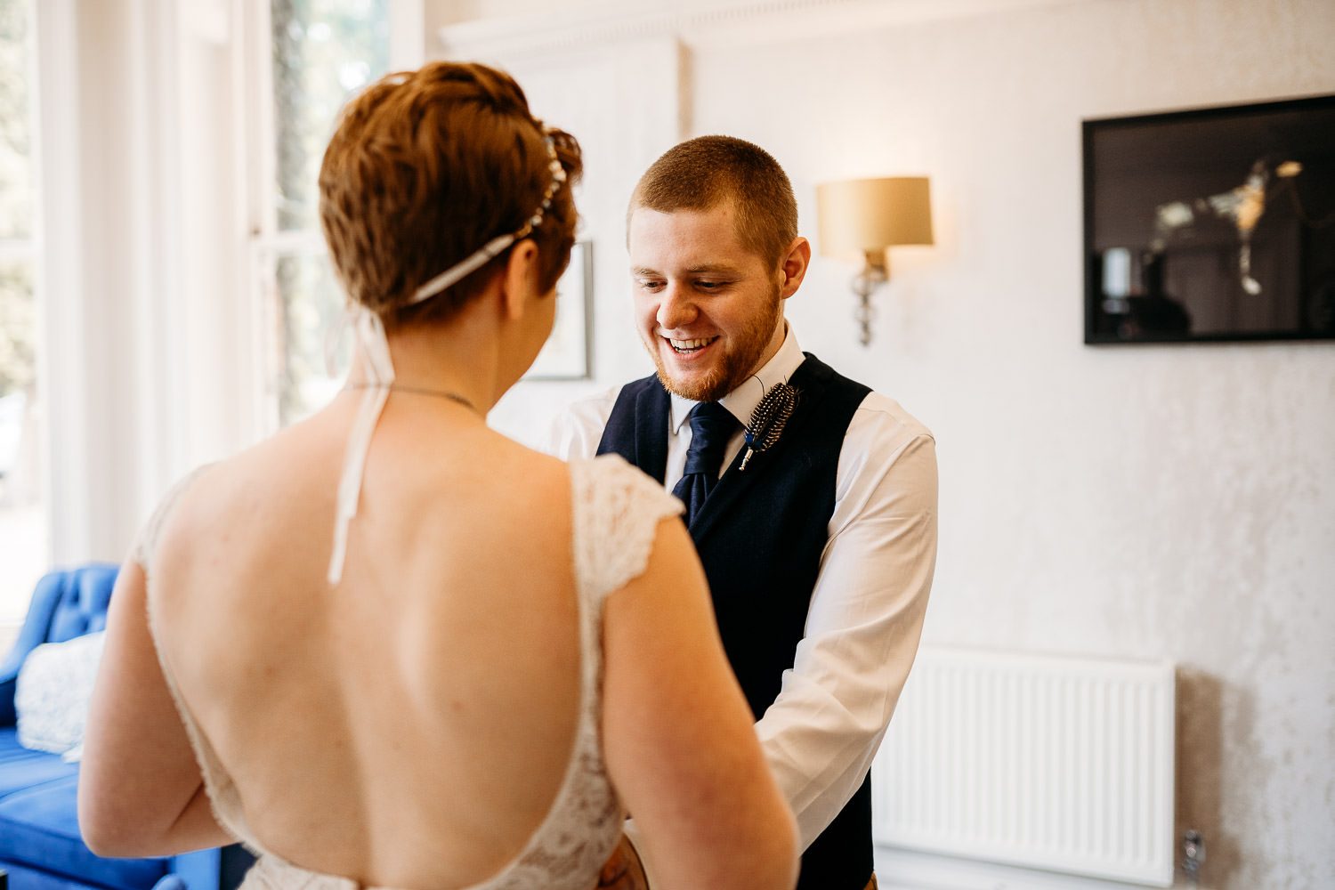 groom smiling at bride during wedding first look in newbury hotel