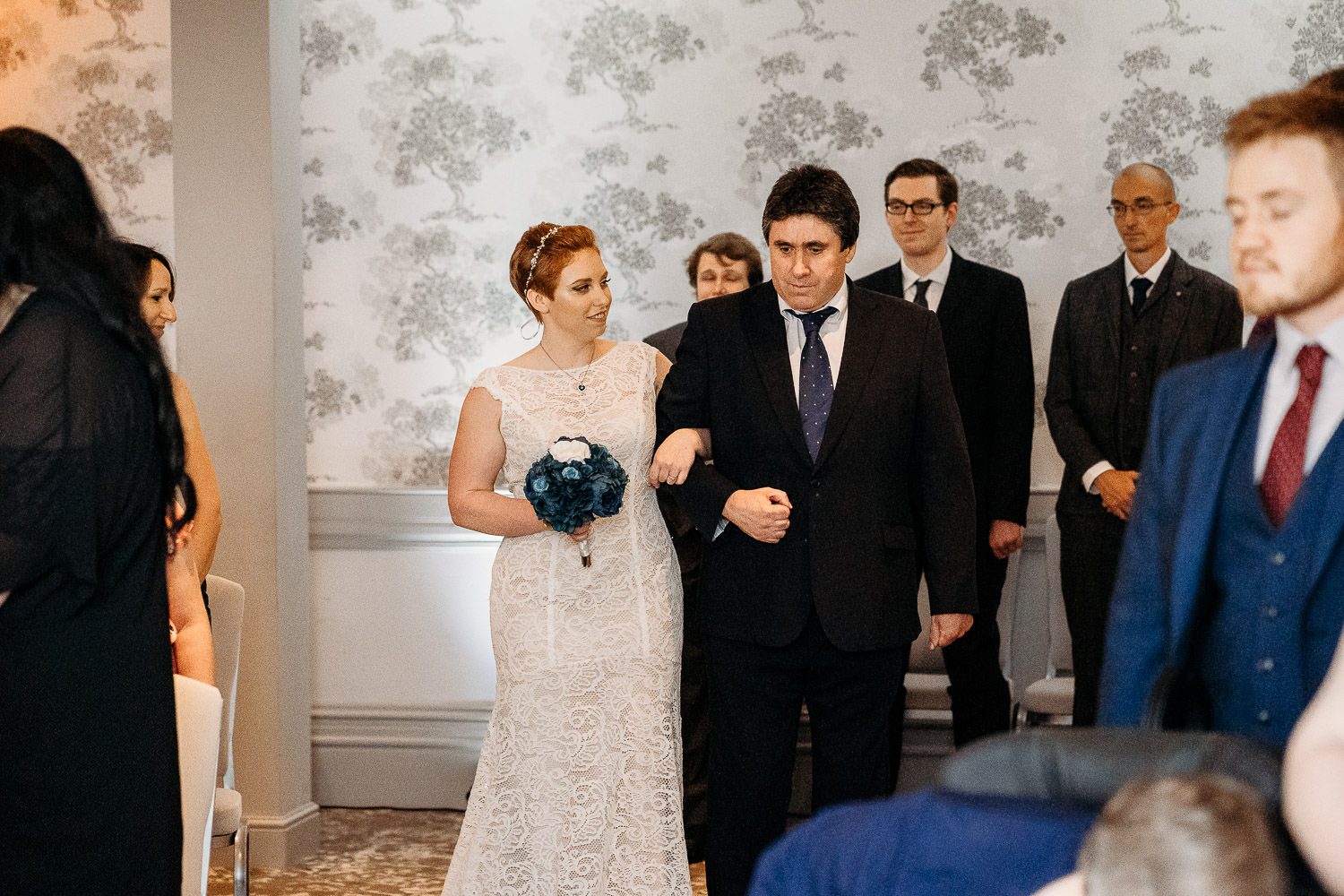 bride and father of the bride walking down the aisle at mercure elcot hotel