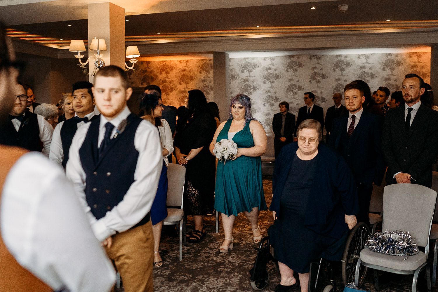 alternative bridesmaid walking down the aisle at elcot park hotel