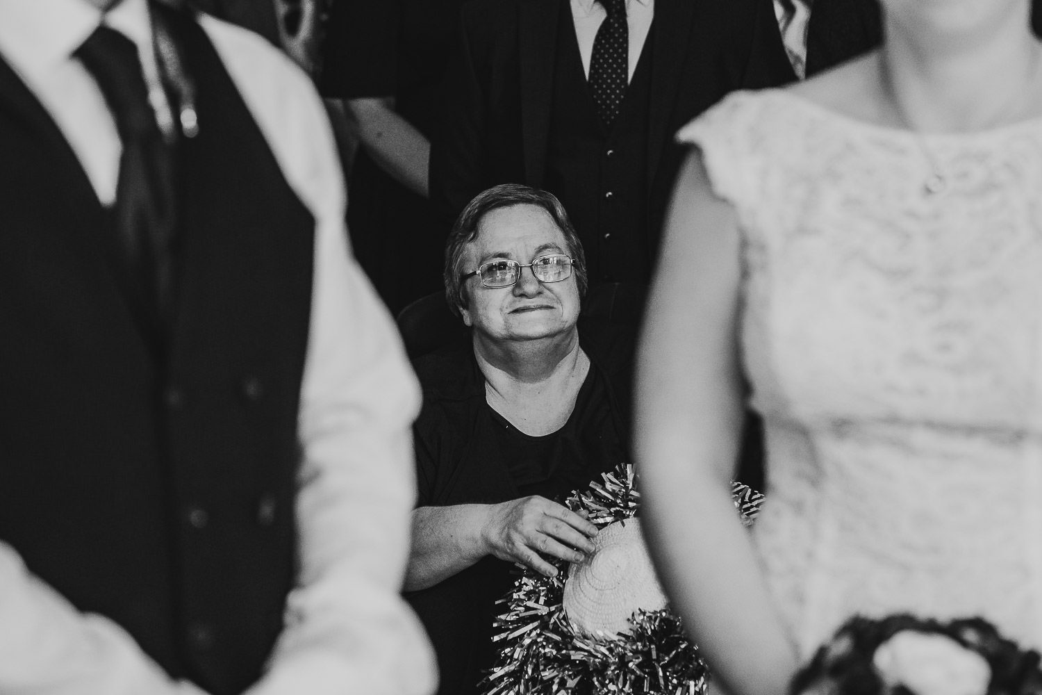 mother of the bride smiling at bride during wedding ceremony at mercure elcot hotel