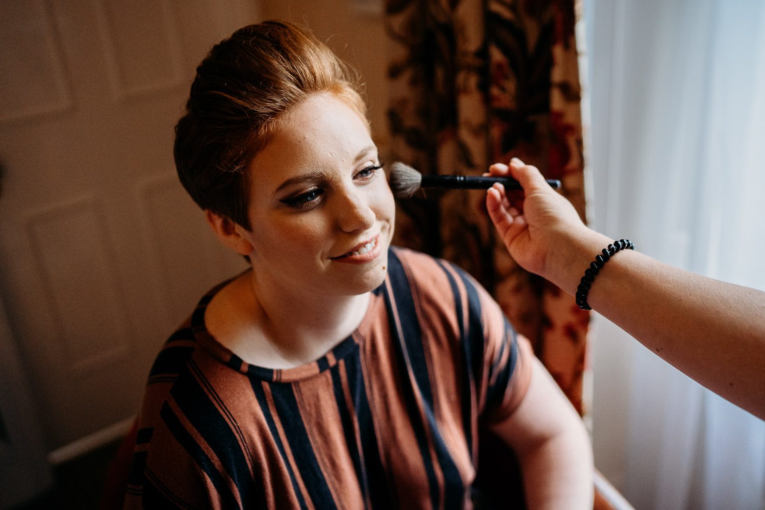 alternative bride having her make up done