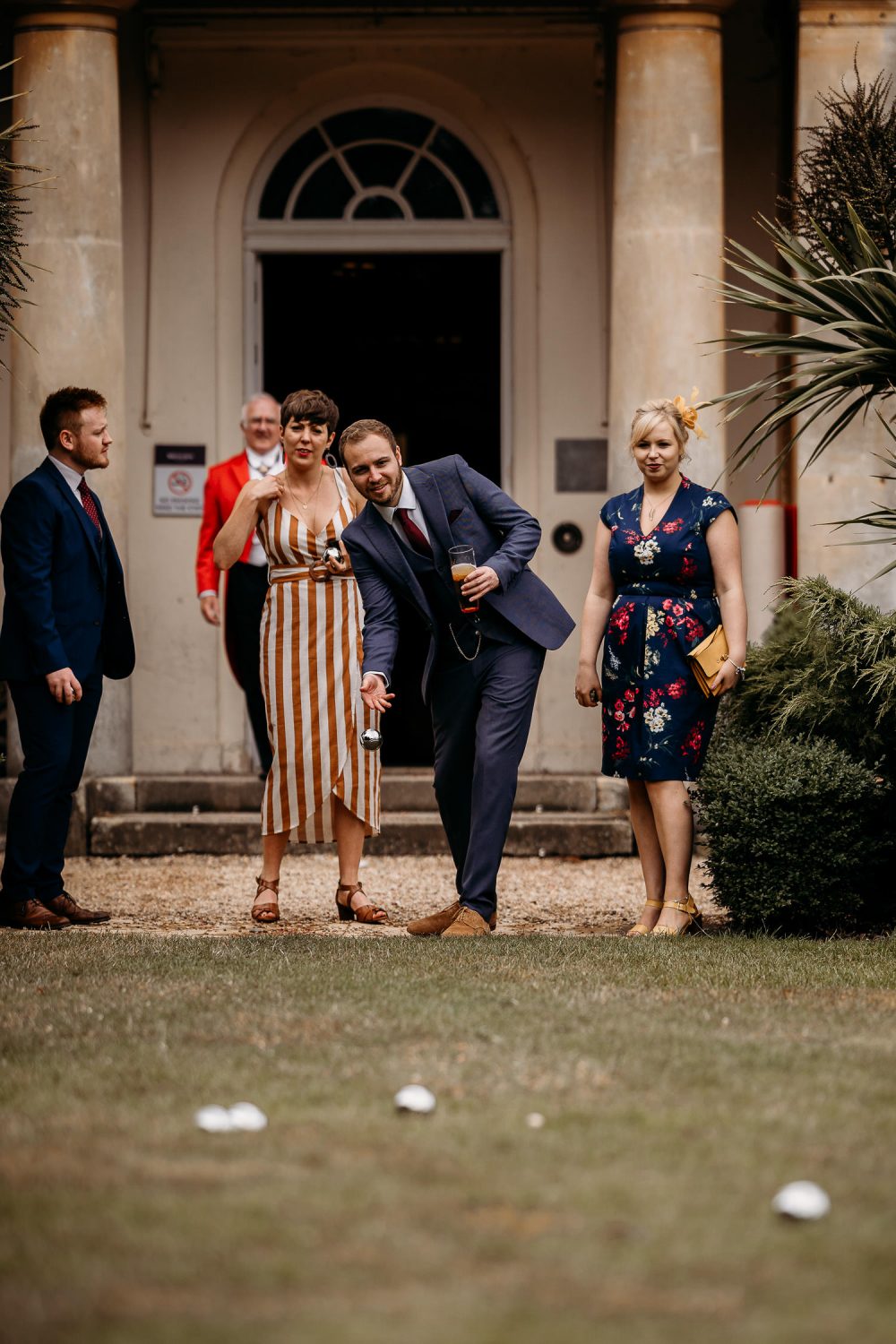wedding guests playing lawn games at relaxed outdoor wedding
