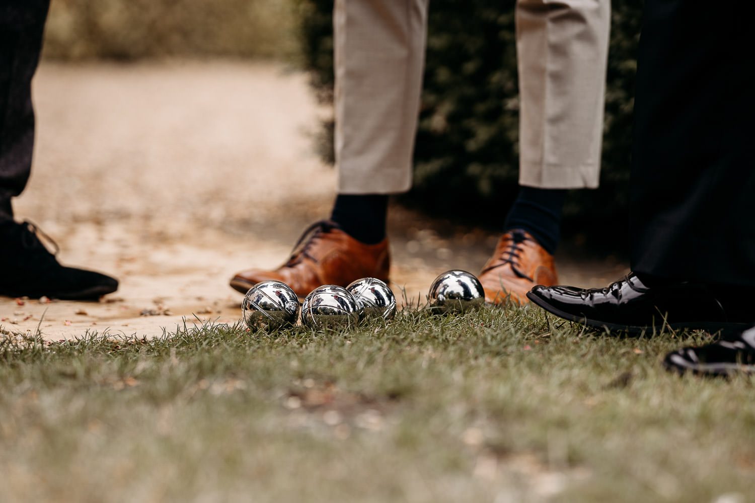 wedding guests playing bowls at outdoor wedding