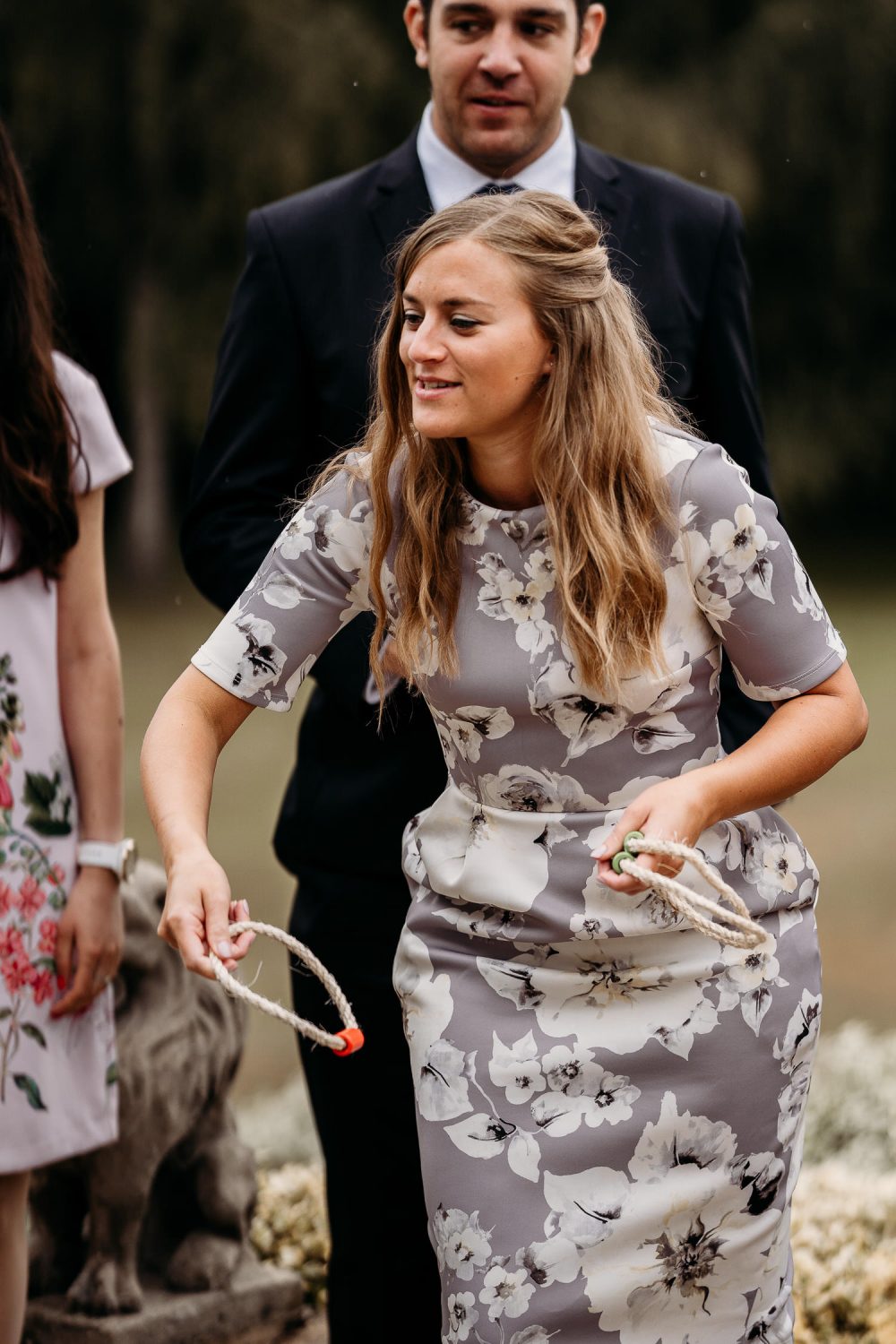 female wedding guest playing lawn game