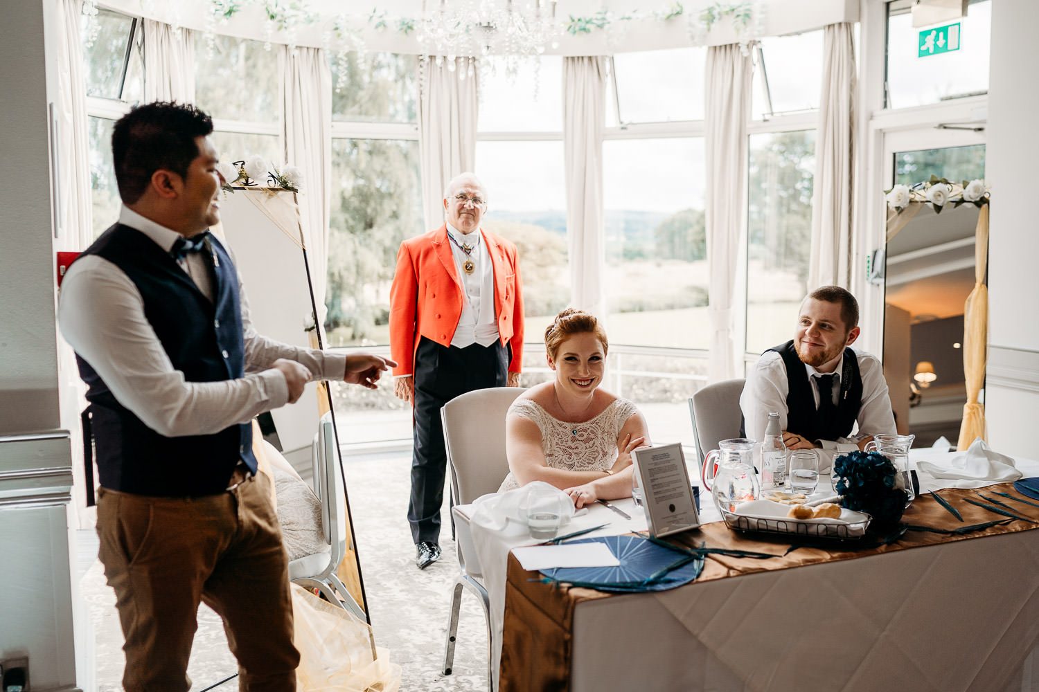 bride and groom laughing during best mans speech quirky alternative wedding