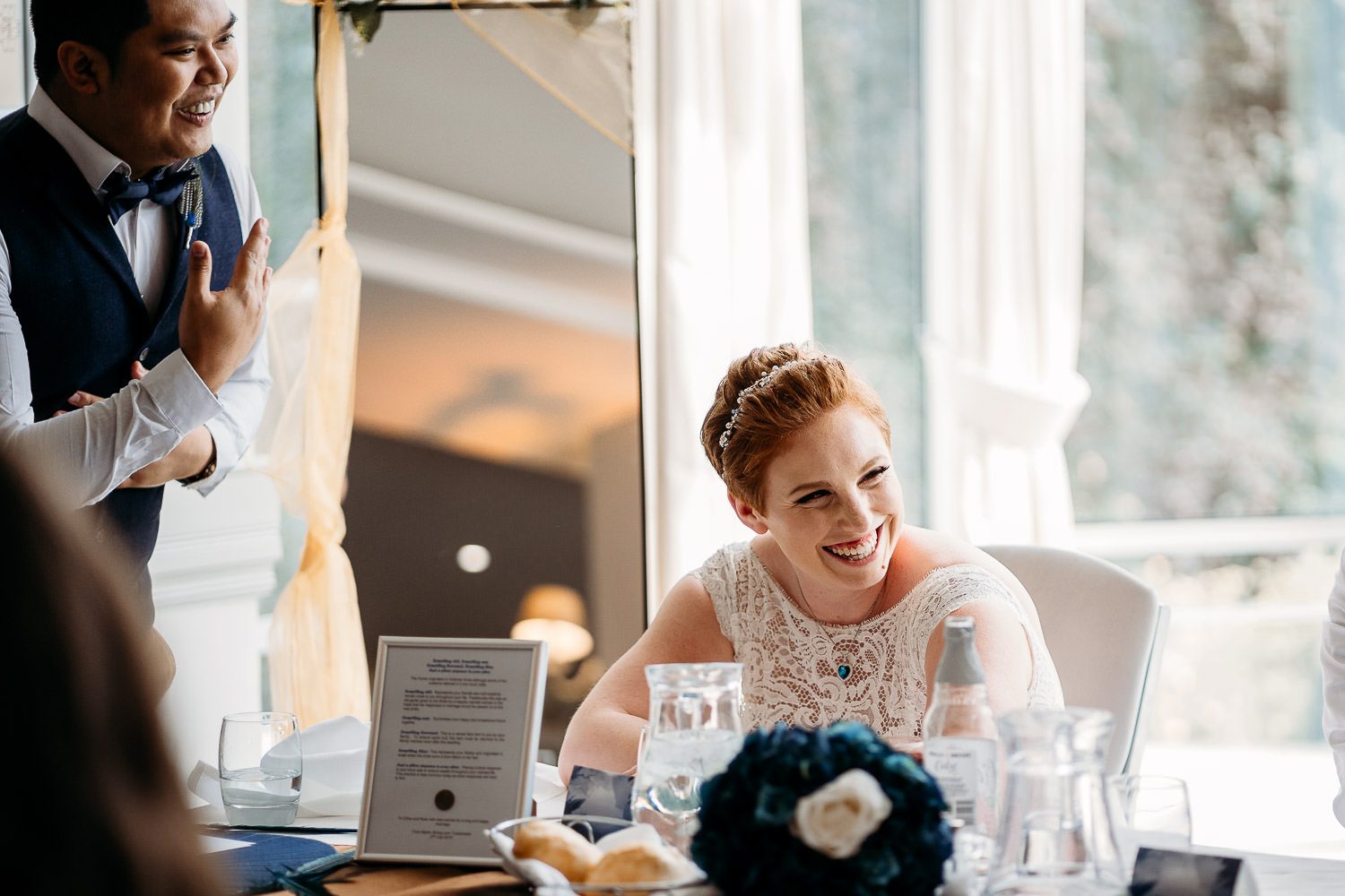 quirky bride laughing during wedding speech
