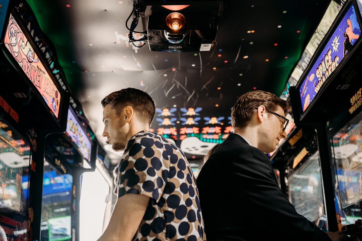 wedding guests playing retro video games at alternative wedding