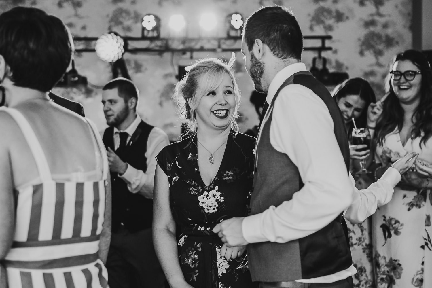 wedding guests dancing during wedding reception