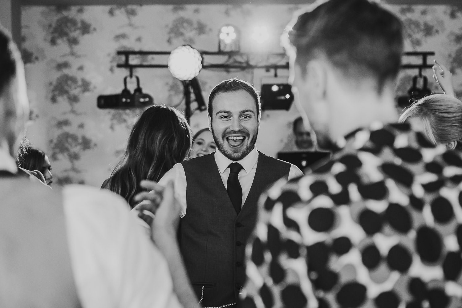 fun wedding guests dancing during reception