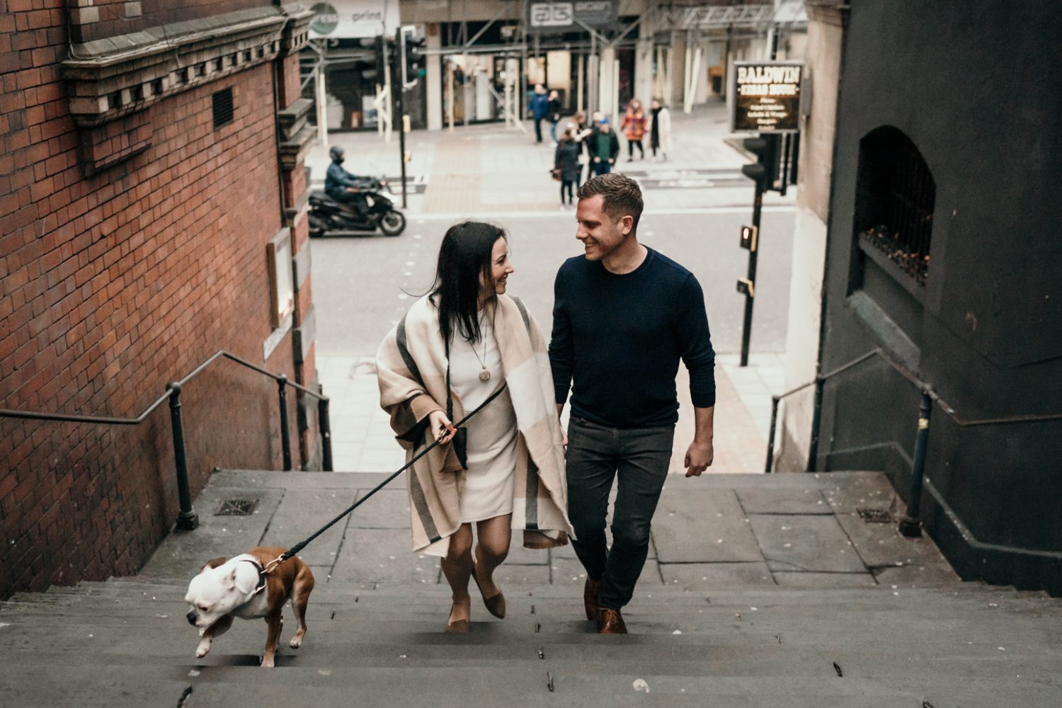 bride and groom walking through bristol streets
