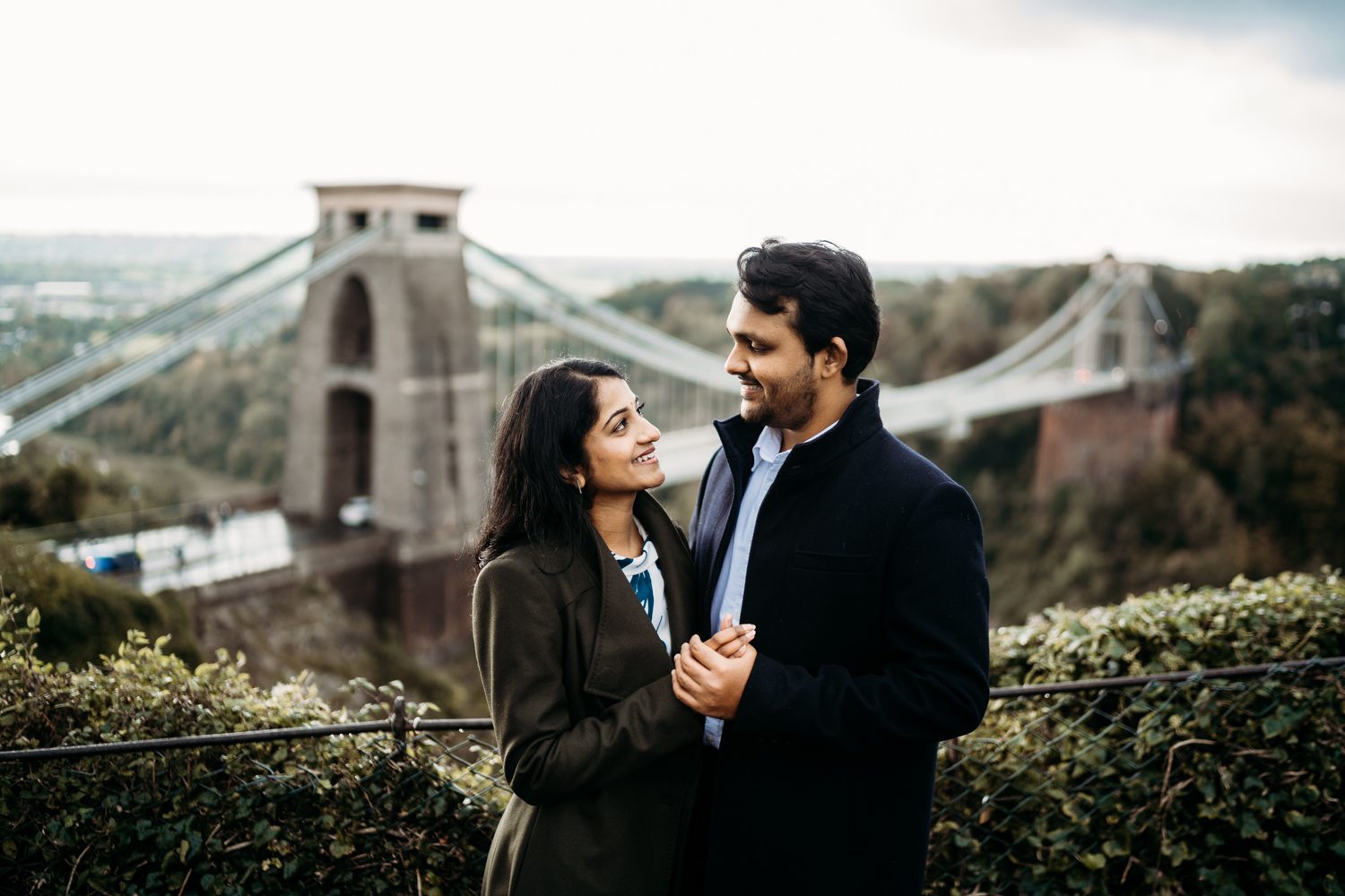 engaged couple in front of bristol suspension bridge