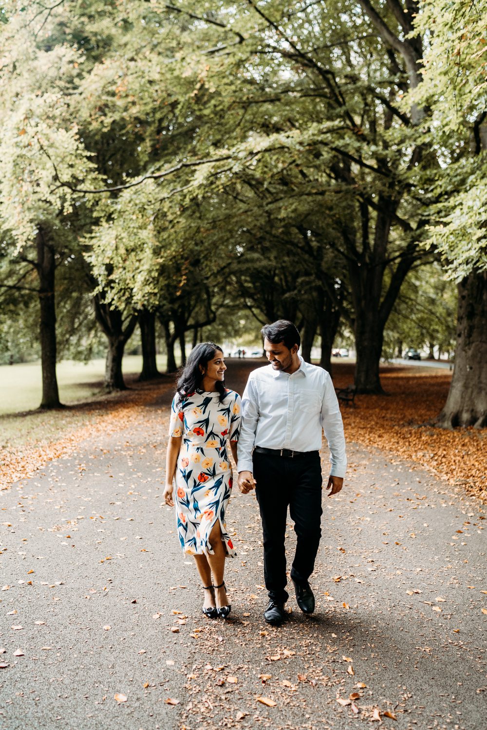 engaged couple walking in the park in bristola
